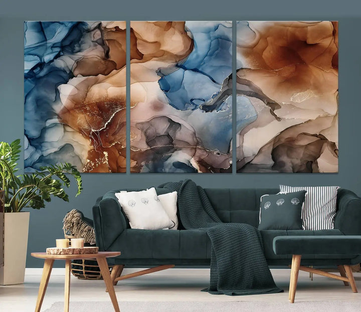 The "Colorful Abstract Clouds Canvas Wall Art Print," featuring an earthy and blue-toned color palette, hangs against a dark wall.