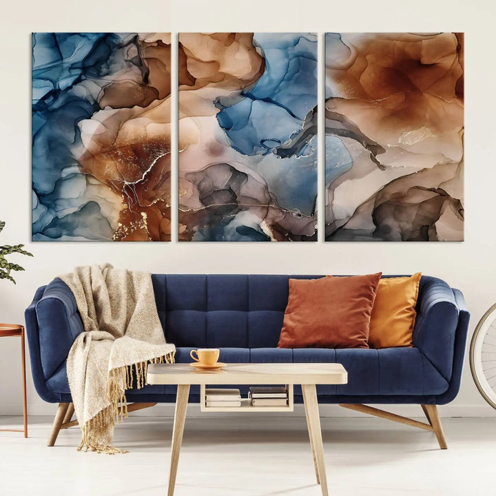 The "Colorful Abstract Clouds Canvas Wall Art Print," featuring an earthy and blue-toned color palette, hangs against a dark wall.