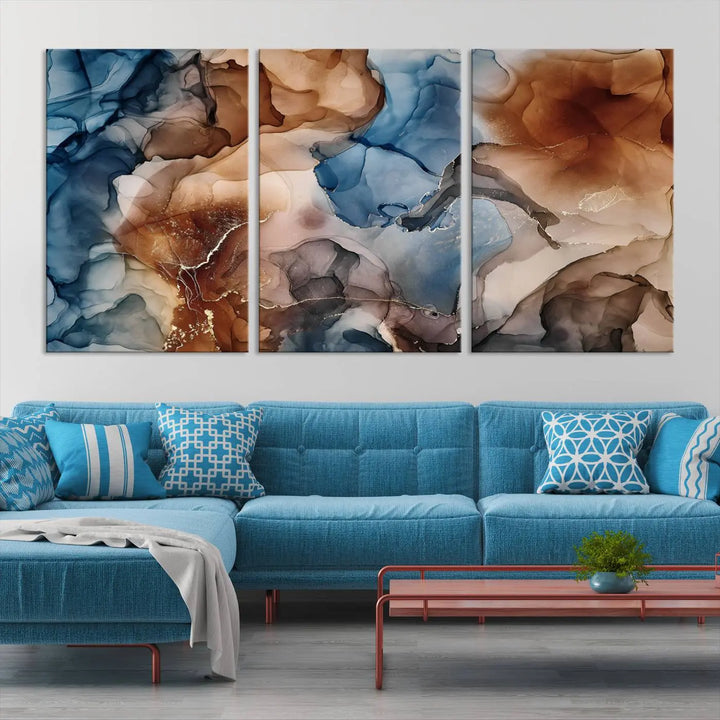 The "Colorful Abstract Clouds Canvas Wall Art Print," featuring an earthy and blue-toned color palette, hangs against a dark wall.