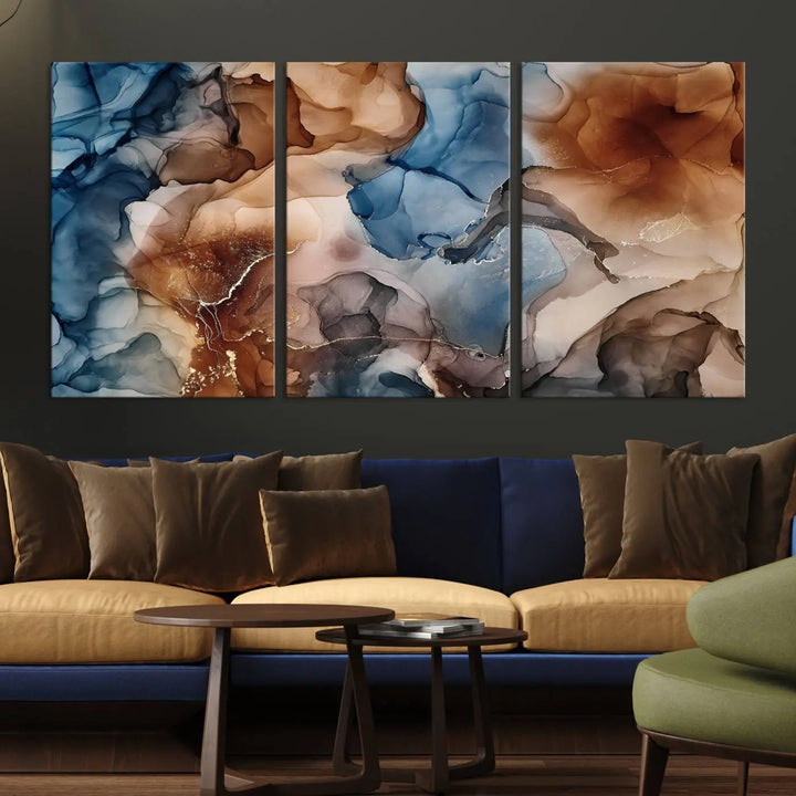 The "Colorful Abstract Clouds Canvas Wall Art Print," featuring an earthy and blue-toned color palette, hangs against a dark wall.