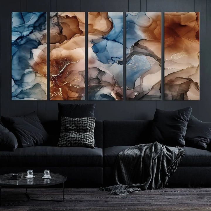 The "Colorful Abstract Clouds Canvas Wall Art Print," featuring an earthy and blue-toned color palette, hangs against a dark wall.