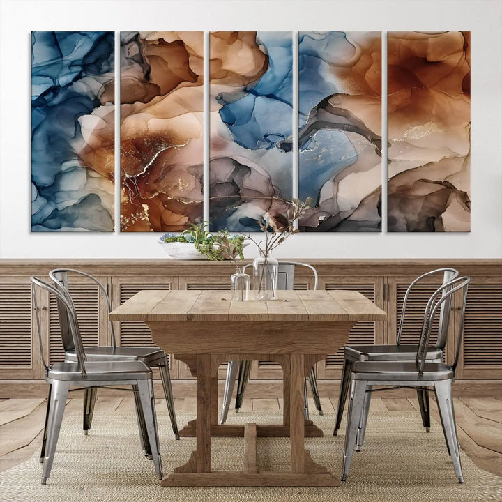 The "Colorful Abstract Clouds Canvas Wall Art Print," featuring an earthy and blue-toned color palette, hangs against a dark wall.