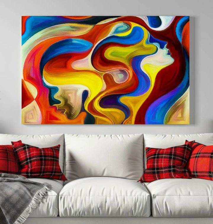 The Colorful Abstract Human Figure Wall Art Canvas Print, featuring overlapping human profiles on museum-quality canvas, is exhibited as a triptych.