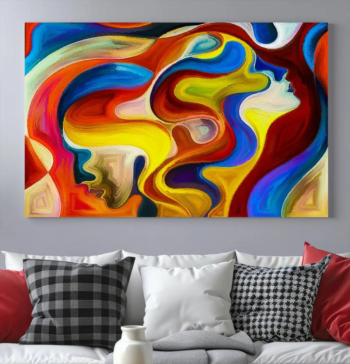 The Colorful Abstract Human Figure Wall Art Canvas Print, featuring overlapping human profiles on museum-quality canvas, is exhibited as a triptych.