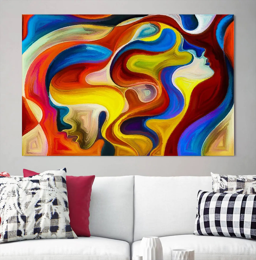 The Colorful Abstract Human Figure Wall Art Canvas Print, featuring overlapping human profiles on museum-quality canvas, is exhibited as a triptych.