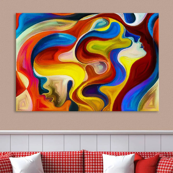 The Colorful Abstract Human Figure Wall Art Canvas Print, featuring overlapping human profiles on museum-quality canvas, is exhibited as a triptych.