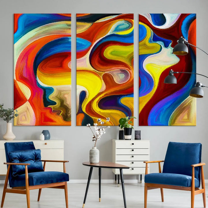 The Colorful Abstract Human Figure Wall Art Canvas Print, featuring overlapping human profiles on museum-quality canvas, is exhibited as a triptych.