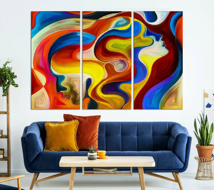 The Colorful Abstract Human Figure Wall Art Canvas Print, featuring overlapping human profiles on museum-quality canvas, is exhibited as a triptych.