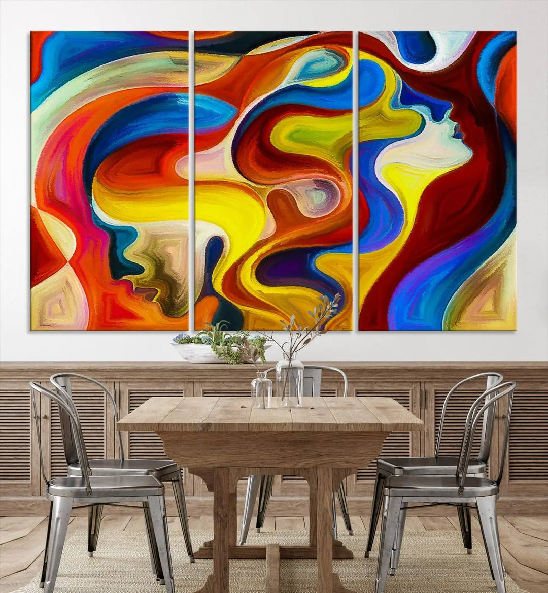 The Colorful Abstract Human Figure Wall Art Canvas Print, featuring overlapping human profiles on museum-quality canvas, is exhibited as a triptych.