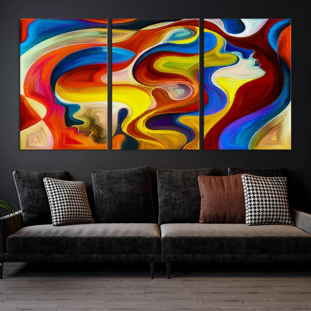 The Colorful Abstract Human Figure Wall Art Canvas Print, featuring overlapping human profiles on museum-quality canvas, is exhibited as a triptych.