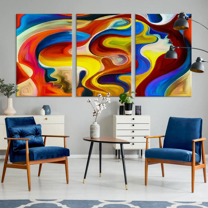 The Colorful Abstract Human Figure Wall Art Canvas Print, featuring overlapping human profiles on museum-quality canvas, is exhibited as a triptych.