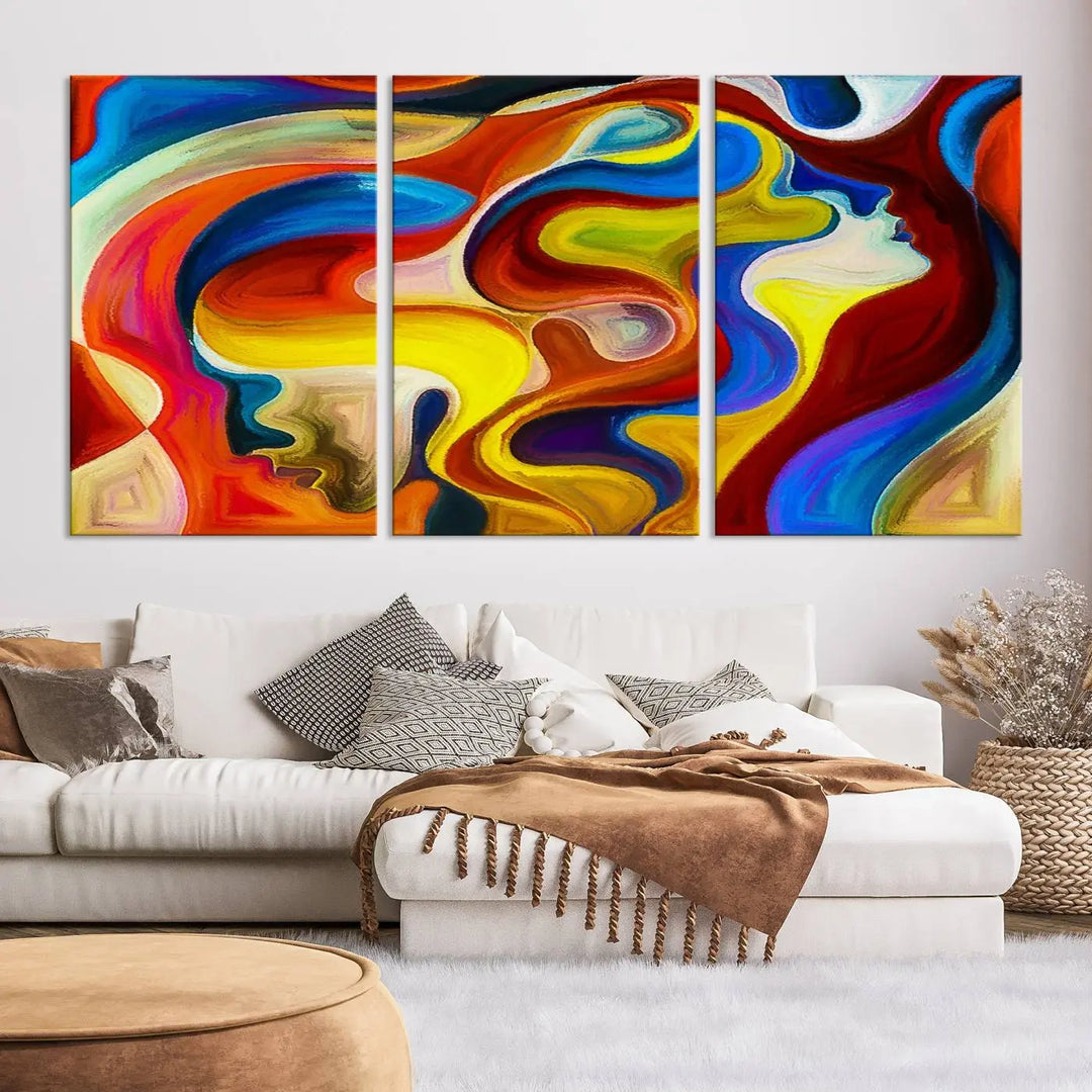 The Colorful Abstract Human Figure Wall Art Canvas Print, featuring overlapping human profiles on museum-quality canvas, is exhibited as a triptych.