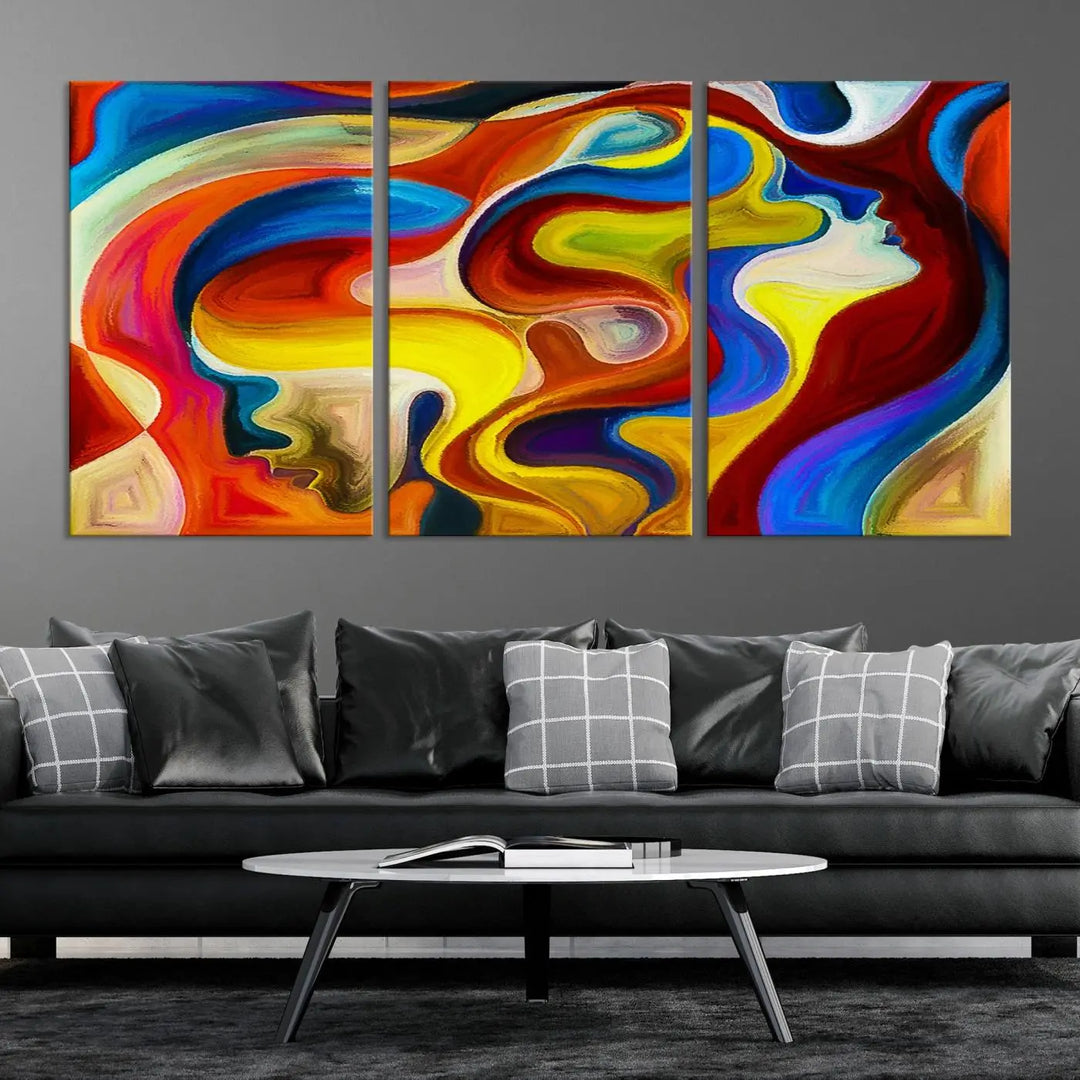 The Colorful Abstract Human Figure Wall Art Canvas Print, featuring overlapping human profiles on museum-quality canvas, is exhibited as a triptych.