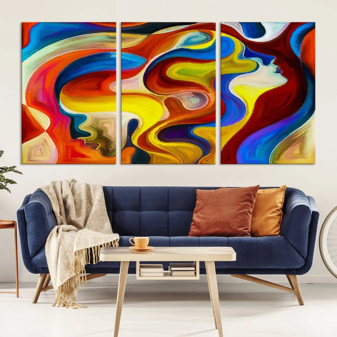 The Colorful Abstract Human Figure Wall Art Canvas Print, featuring overlapping human profiles on museum-quality canvas, is exhibited as a triptych.