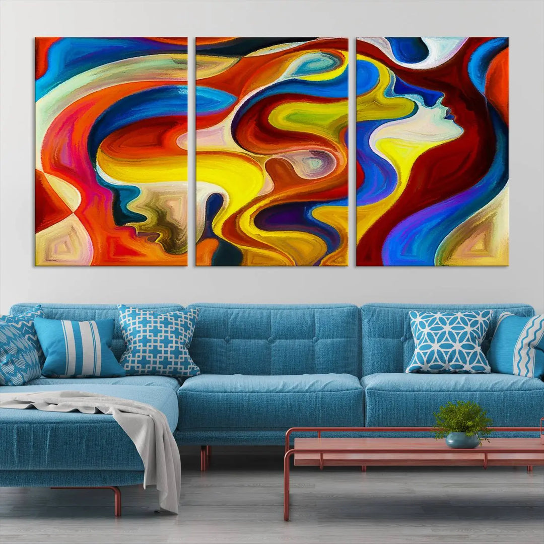 The Colorful Abstract Human Figure Wall Art Canvas Print, featuring overlapping human profiles on museum-quality canvas, is exhibited as a triptych.