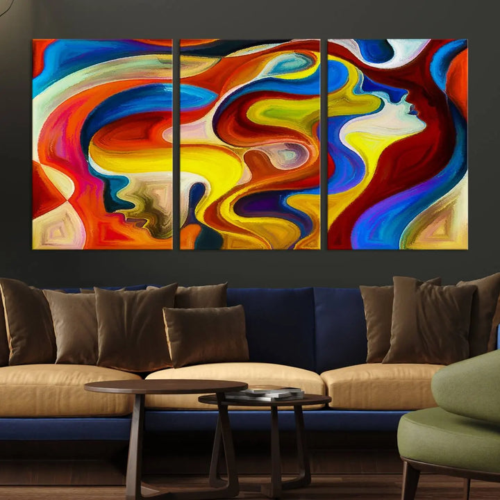 The Colorful Abstract Human Figure Wall Art Canvas Print, featuring overlapping human profiles on museum-quality canvas, is exhibited as a triptych.