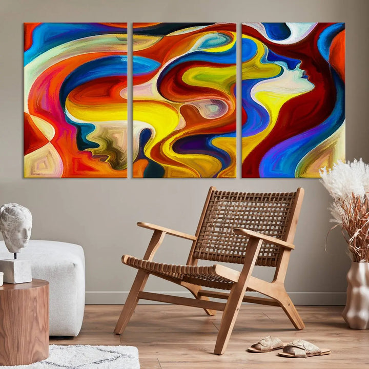 The Colorful Abstract Human Figure Wall Art Canvas Print, featuring overlapping human profiles on museum-quality canvas, is exhibited as a triptych.