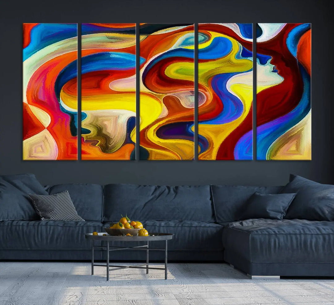 The Colorful Abstract Human Figure Wall Art Canvas Print, featuring overlapping human profiles on museum-quality canvas, is exhibited as a triptych.