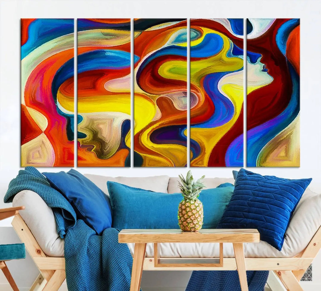 The Colorful Abstract Human Figure Wall Art Canvas Print, featuring overlapping human profiles on museum-quality canvas, is exhibited as a triptych.