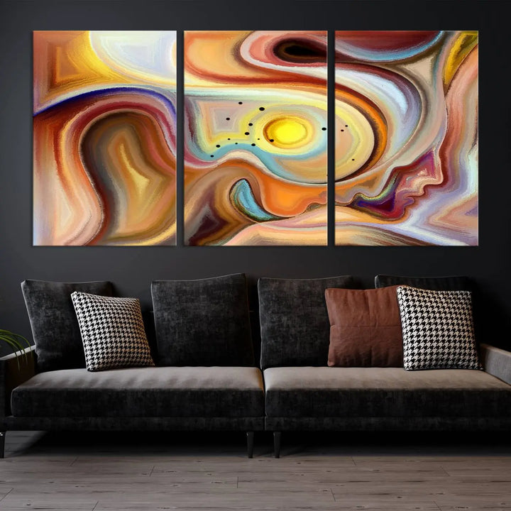 The "Colorful Abstract Human Figures Wall Art Canvas Print" features a triptych design with swirling colors in yellow, brown, and orange tones on gallery-wrapped, museum-quality canvases.