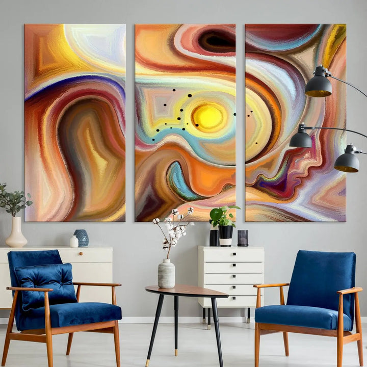 The "Colorful Abstract Human Figures Wall Art Canvas Print" features a triptych design with swirling colors in yellow, brown, and orange tones on gallery-wrapped, museum-quality canvases.