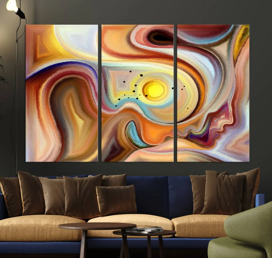 The "Colorful Abstract Human Figures Wall Art Canvas Print" features a triptych design with swirling colors in yellow, brown, and orange tones on gallery-wrapped, museum-quality canvases.