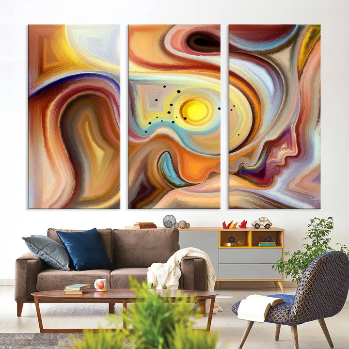 The "Colorful Abstract Human Figures Wall Art Canvas Print" features a triptych design with swirling colors in yellow, brown, and orange tones on gallery-wrapped, museum-quality canvases.