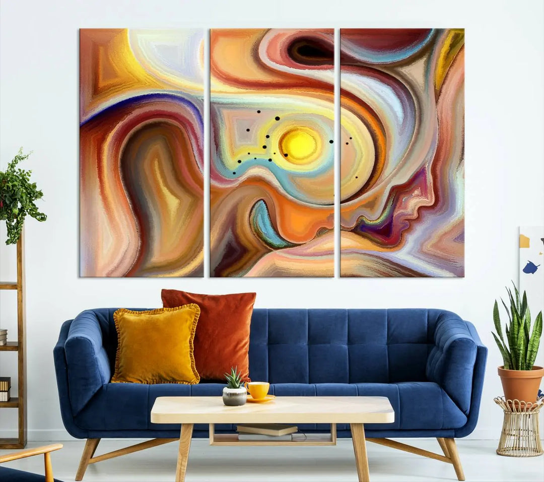 The "Colorful Abstract Human Figures Wall Art Canvas Print" features a triptych design with swirling colors in yellow, brown, and orange tones on gallery-wrapped, museum-quality canvases.