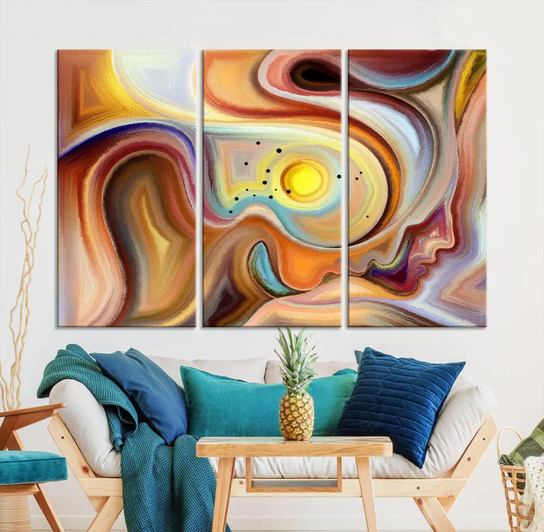 The "Colorful Abstract Human Figures Wall Art Canvas Print" features a triptych design with swirling colors in yellow, brown, and orange tones on gallery-wrapped, museum-quality canvases.