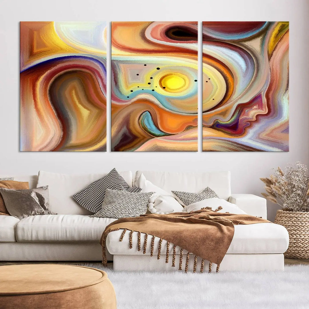 The "Colorful Abstract Human Figures Wall Art Canvas Print" features a triptych design with swirling colors in yellow, brown, and orange tones on gallery-wrapped, museum-quality canvases.