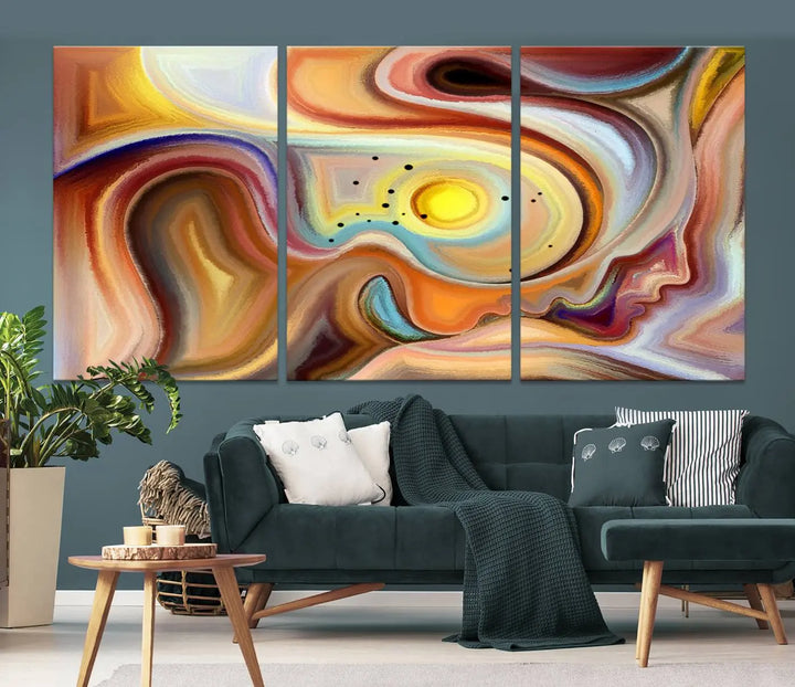 The "Colorful Abstract Human Figures Wall Art Canvas Print" features a triptych design with swirling colors in yellow, brown, and orange tones on gallery-wrapped, museum-quality canvases.