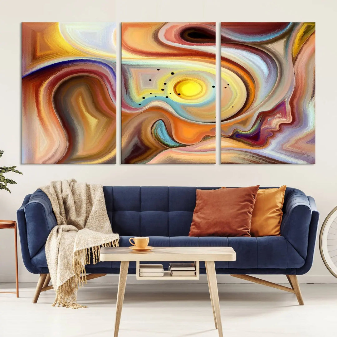 The "Colorful Abstract Human Figures Wall Art Canvas Print" features a triptych design with swirling colors in yellow, brown, and orange tones on gallery-wrapped, museum-quality canvases.