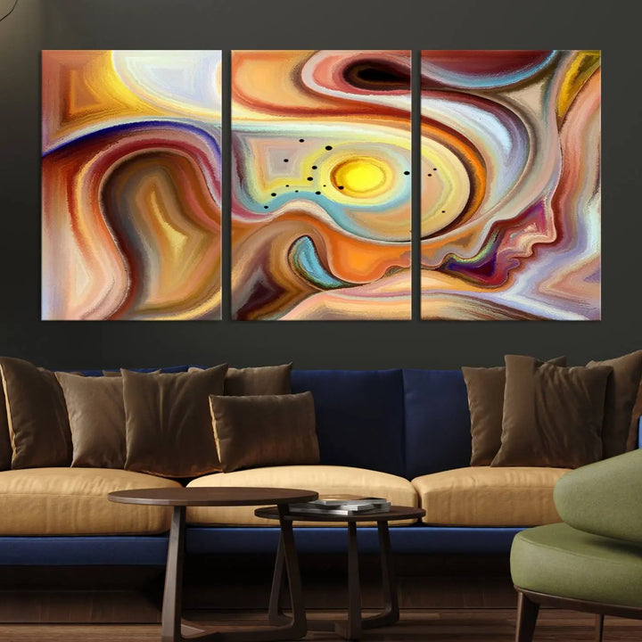 The "Colorful Abstract Human Figures Wall Art Canvas Print" features a triptych design with swirling colors in yellow, brown, and orange tones on gallery-wrapped, museum-quality canvases.