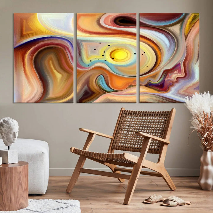 The "Colorful Abstract Human Figures Wall Art Canvas Print" features a triptych design with swirling colors in yellow, brown, and orange tones on gallery-wrapped, museum-quality canvases.