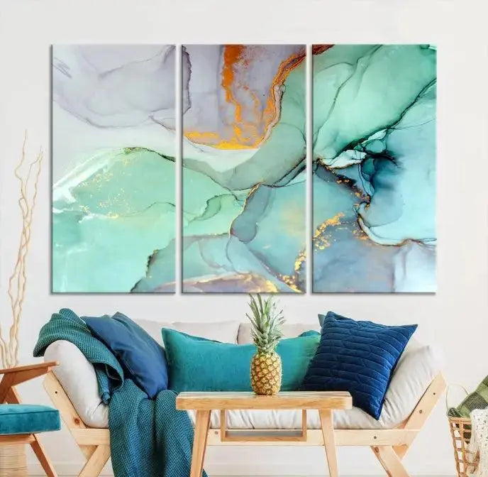 Contemporary living room featuring the Colorful Marble Fluid Effect Wall Art Abstract Canvas Wall Art Print, showcasing multi-panel abstract designs in teal, gold, and white tones. This museum-quality canvas artwork is ready to hang and finished with a UV-protective coating for enduring vibrancy.