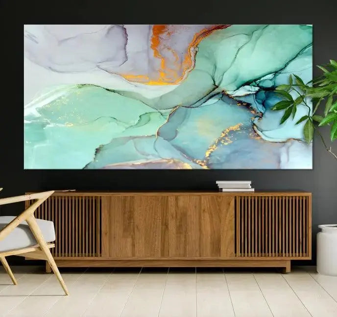 Contemporary living room featuring the Colorful Marble Fluid Effect Wall Art Abstract Canvas Wall Art Print, showcasing multi-panel abstract designs in teal, gold, and white tones. This museum-quality canvas artwork is ready to hang and finished with a UV-protective coating for enduring vibrancy.