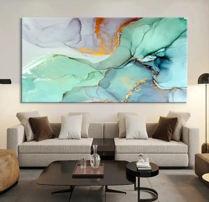 Contemporary living room featuring the Colorful Marble Fluid Effect Wall Art Abstract Canvas Wall Art Print, showcasing multi-panel abstract designs in teal, gold, and white tones. This museum-quality canvas artwork is ready to hang and finished with a UV-protective coating for enduring vibrancy.