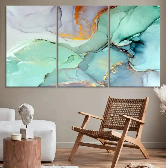 Contemporary living room featuring the Colorful Marble Fluid Effect Wall Art Abstract Canvas Wall Art Print, showcasing multi-panel abstract designs in teal, gold, and white tones. This museum-quality canvas artwork is ready to hang and finished with a UV-protective coating for enduring vibrancy.