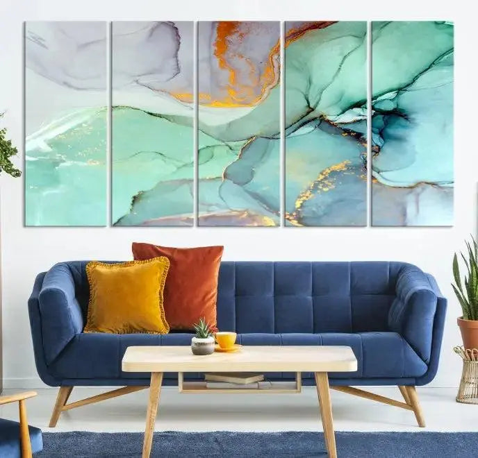 Contemporary living room featuring the Colorful Marble Fluid Effect Wall Art Abstract Canvas Wall Art Print, showcasing multi-panel abstract designs in teal, gold, and white tones. This museum-quality canvas artwork is ready to hang and finished with a UV-protective coating for enduring vibrancy.