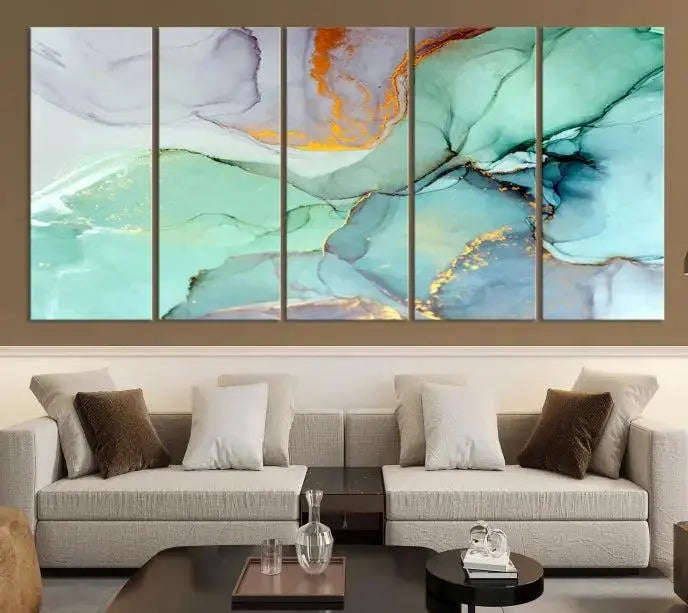 Contemporary living room featuring the Colorful Marble Fluid Effect Wall Art Abstract Canvas Wall Art Print, showcasing multi-panel abstract designs in teal, gold, and white tones. This museum-quality canvas artwork is ready to hang and finished with a UV-protective coating for enduring vibrancy.