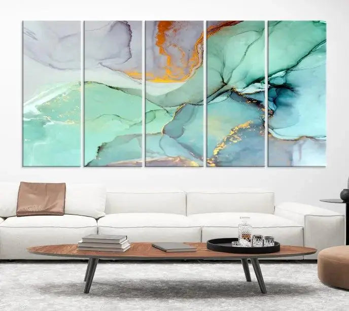 Contemporary living room featuring the Colorful Marble Fluid Effect Wall Art Abstract Canvas Wall Art Print, showcasing multi-panel abstract designs in teal, gold, and white tones. This museum-quality canvas artwork is ready to hang and finished with a UV-protective coating for enduring vibrancy.