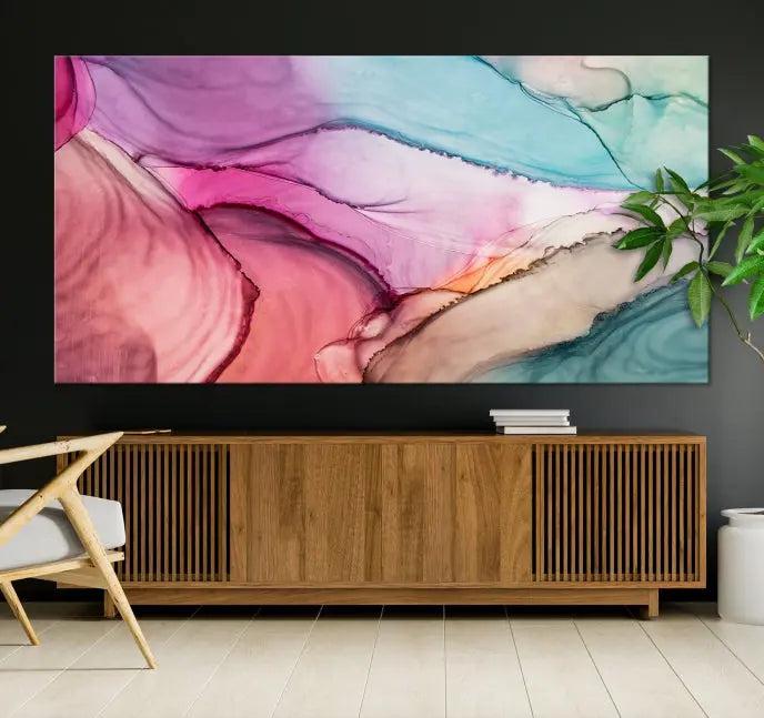 A set of Colorful Marble Fluid Effect Wall Art Abstract Canvas Wall Art Prints showcases pink, blue, and beige swirls. These gallery-wrapped canvases boast museum-quality finesse with a UV-protective coating for enduring vibrancy.