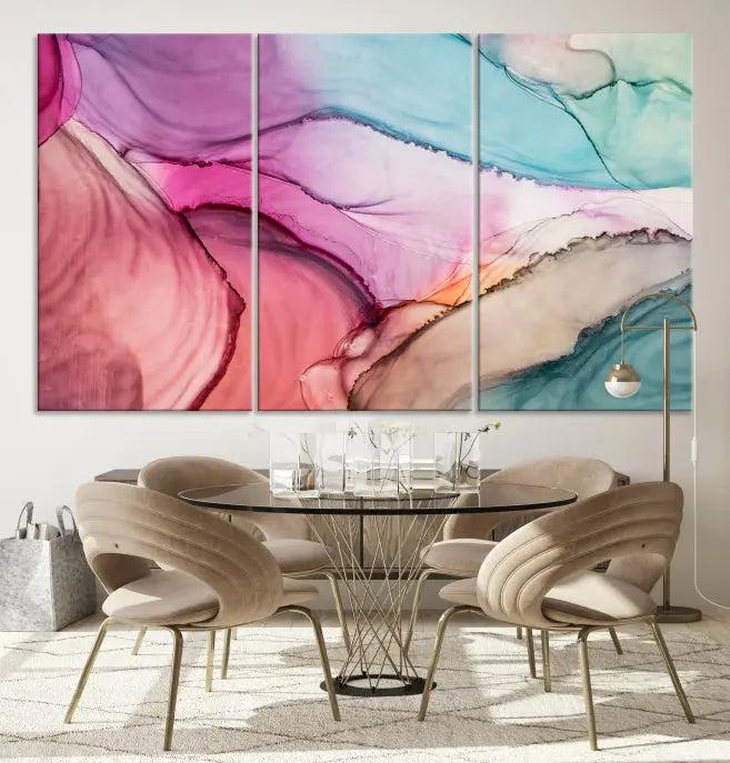 A set of Colorful Marble Fluid Effect Wall Art Abstract Canvas Wall Art Prints showcases pink, blue, and beige swirls. These gallery-wrapped canvases boast museum-quality finesse with a UV-protective coating for enduring vibrancy.