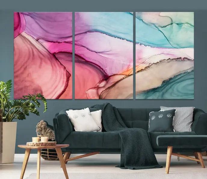 A set of Colorful Marble Fluid Effect Wall Art Abstract Canvas Wall Art Prints showcases pink, blue, and beige swirls. These gallery-wrapped canvases boast museum-quality finesse with a UV-protective coating for enduring vibrancy.