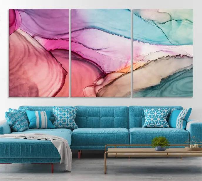 A set of Colorful Marble Fluid Effect Wall Art Abstract Canvas Wall Art Prints showcases pink, blue, and beige swirls. These gallery-wrapped canvases boast museum-quality finesse with a UV-protective coating for enduring vibrancy.