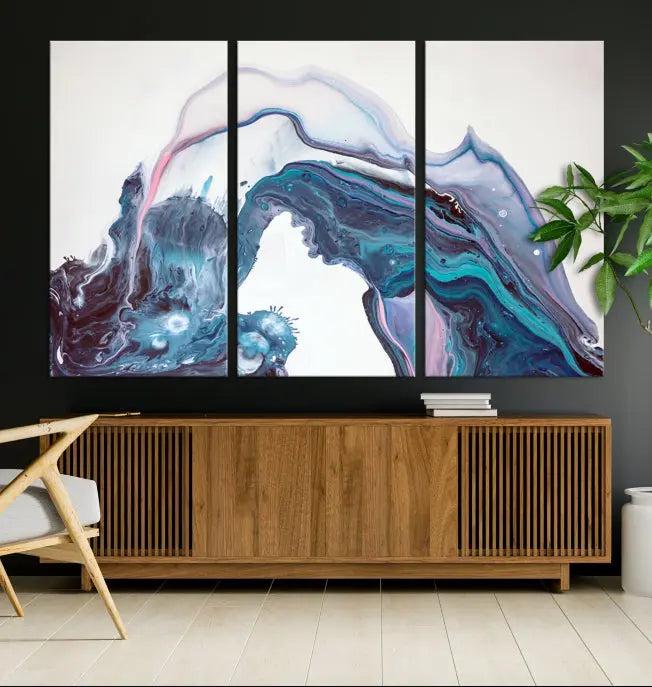 A stunning triptych of the "Colorful Marble Fluid Effect Wall Art Abstract Canvas Wall Art Print" in blue and purple hues hangs prominently in this modern living room.