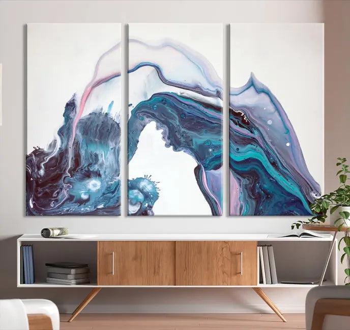 A stunning triptych of the "Colorful Marble Fluid Effect Wall Art Abstract Canvas Wall Art Print" in blue and purple hues hangs prominently in this modern living room.