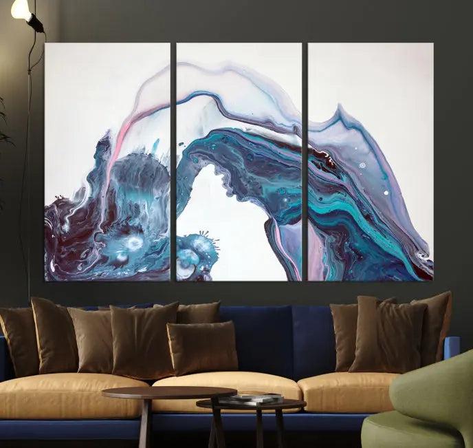 A stunning triptych of the "Colorful Marble Fluid Effect Wall Art Abstract Canvas Wall Art Print" in blue and purple hues hangs prominently in this modern living room.