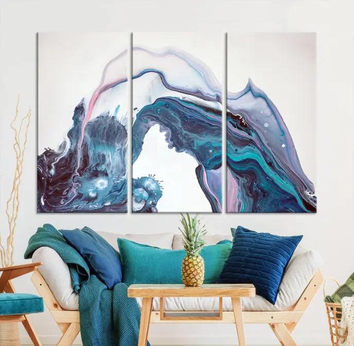 A stunning triptych of the "Colorful Marble Fluid Effect Wall Art Abstract Canvas Wall Art Print" in blue and purple hues hangs prominently in this modern living room.