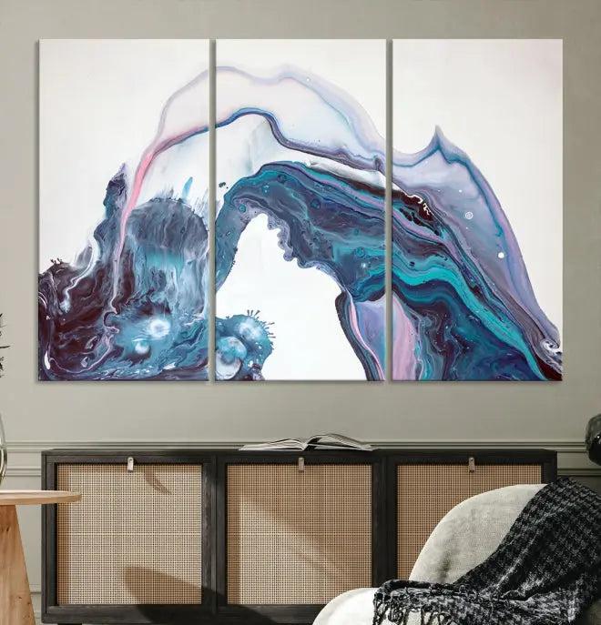 A stunning triptych of the "Colorful Marble Fluid Effect Wall Art Abstract Canvas Wall Art Print" in blue and purple hues hangs prominently in this modern living room.